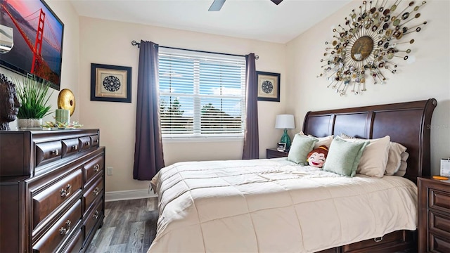 bedroom featuring dark wood-type flooring and ceiling fan