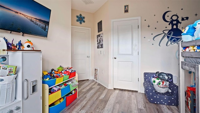 recreation room featuring hardwood / wood-style flooring