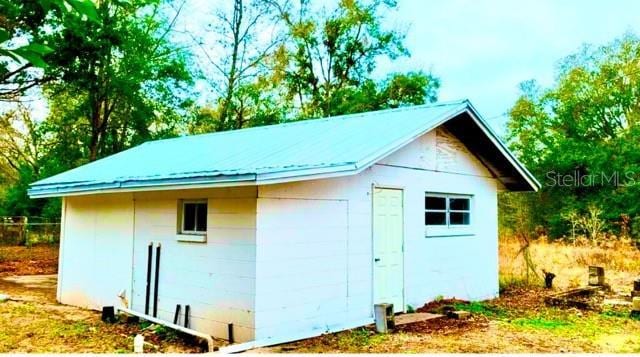 view of outdoor structure featuring a garage