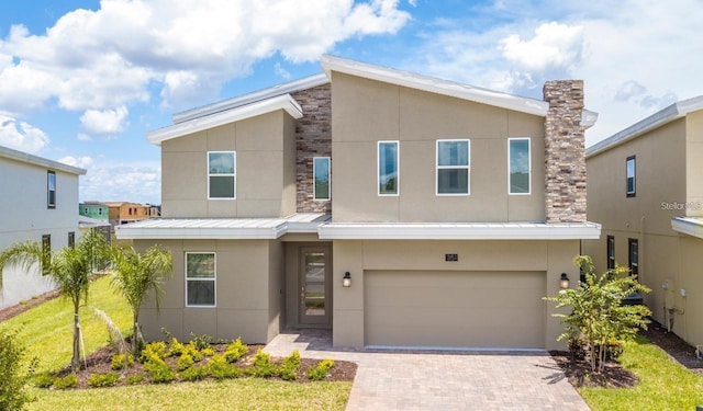 modern home with a garage and a front yard