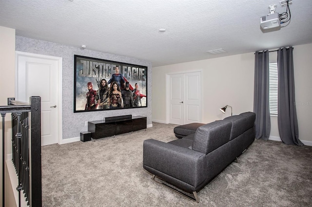 carpeted cinema featuring a textured ceiling