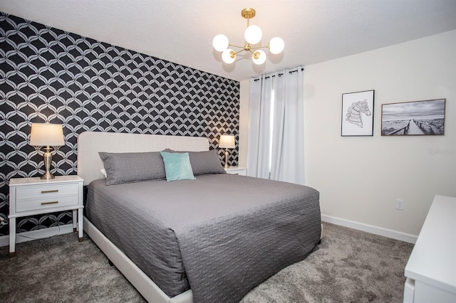 bedroom with an inviting chandelier and carpet flooring