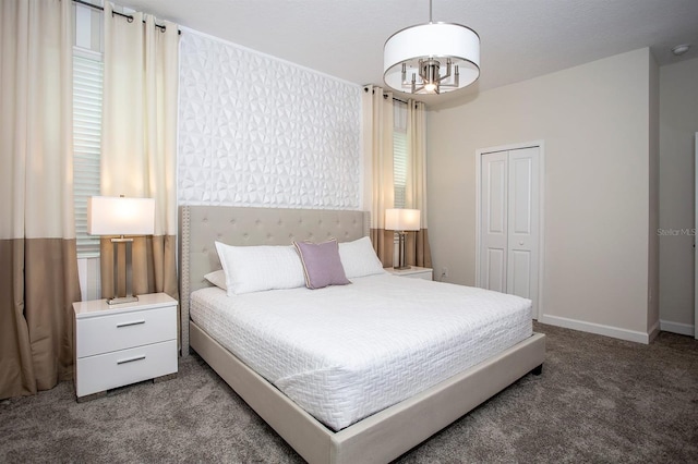 bedroom with carpet flooring and a closet