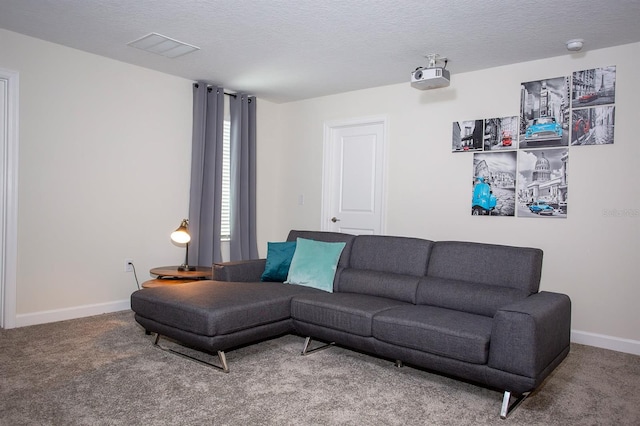 carpeted living room with a textured ceiling