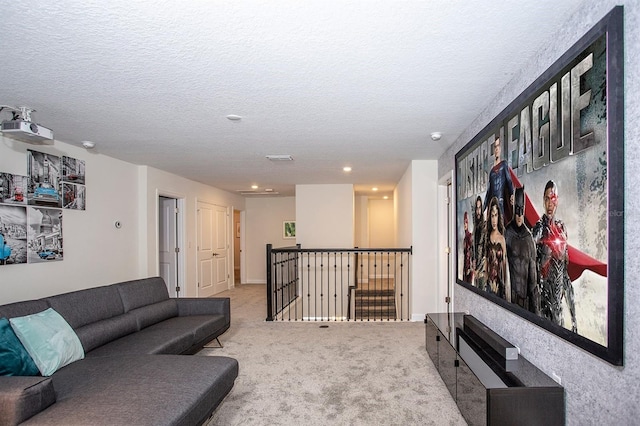 living room with light carpet and a textured ceiling