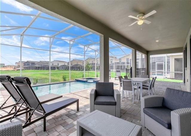 view of patio featuring a swimming pool with hot tub, an outdoor hangout area, ceiling fan, and glass enclosure