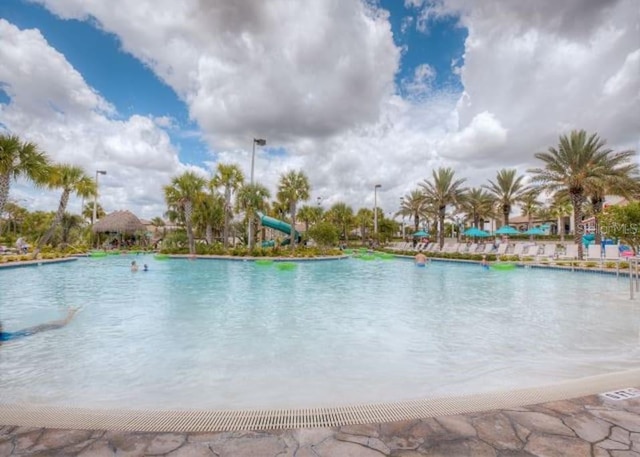 view of pool with a water slide