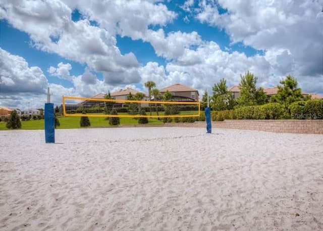 view of home's community featuring volleyball court