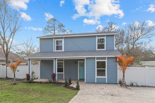 front facade with a front lawn