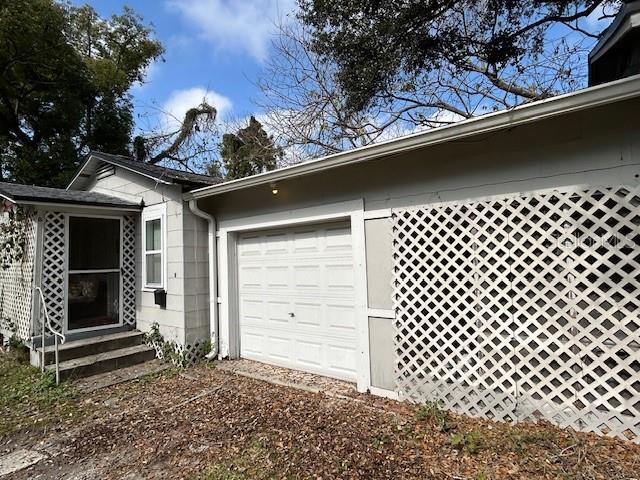 view of side of property with a garage