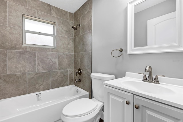 full bathroom with vanity, toilet, and tiled shower / bath combo