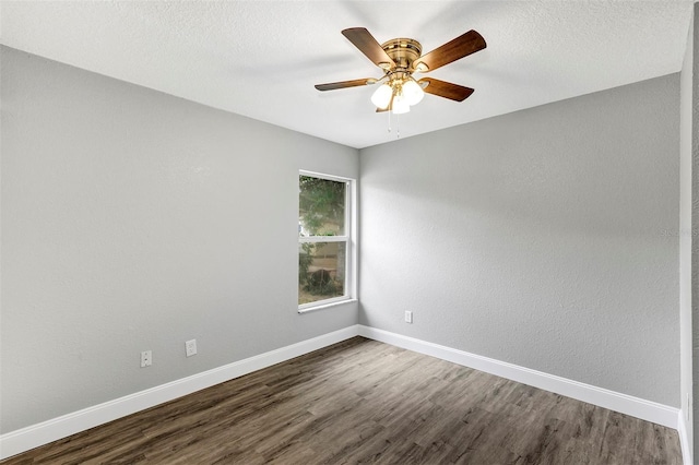 unfurnished room with dark hardwood / wood-style floors, a textured ceiling, and ceiling fan