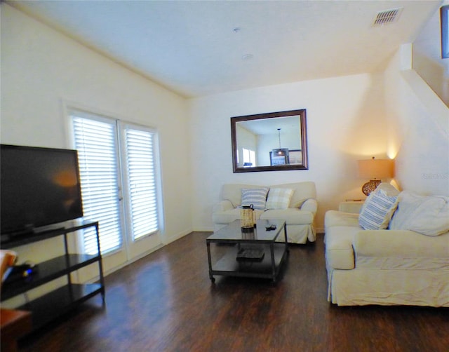 living room featuring dark hardwood / wood-style flooring