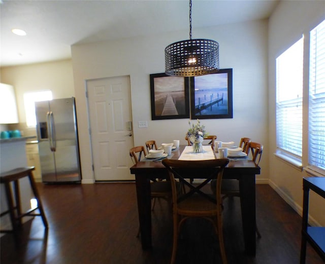 dining space with dark wood-type flooring