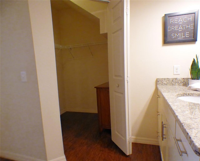 bathroom with vanity and hardwood / wood-style floors