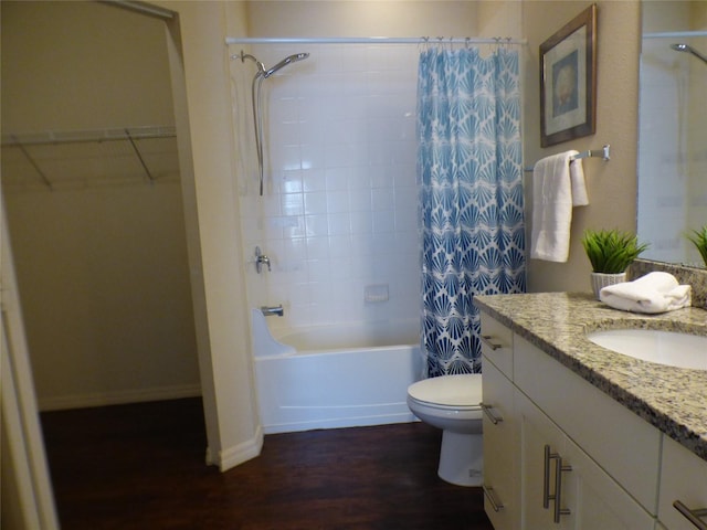 full bathroom featuring hardwood / wood-style floors, vanity, toilet, and shower / bath combo with shower curtain