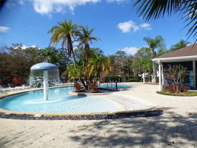 view of swimming pool featuring pool water feature