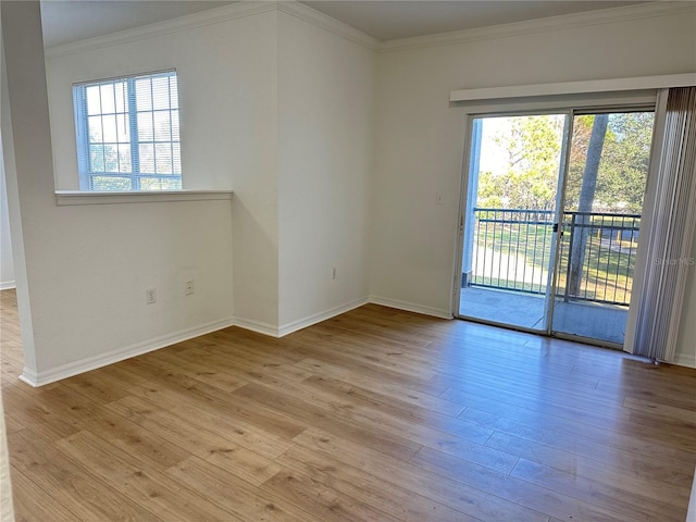 unfurnished room with light hardwood / wood-style flooring and ornamental molding