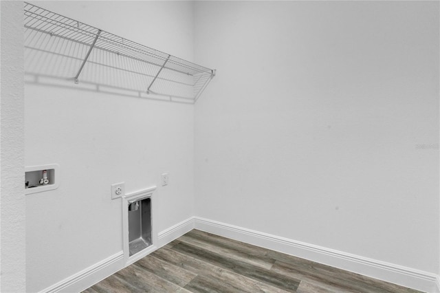 washroom featuring washer hookup, dark wood-type flooring, and hookup for an electric dryer