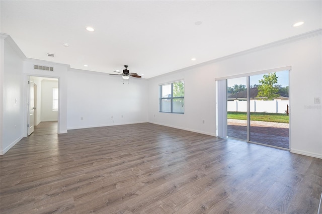 empty room featuring crown molding, ceiling fan, and dark hardwood / wood-style flooring