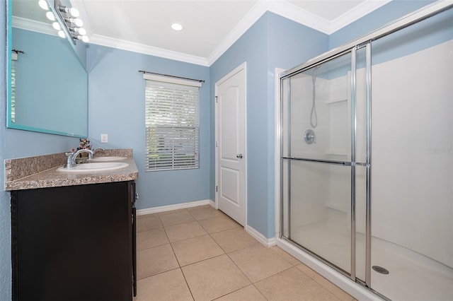 bathroom with an enclosed shower, vanity, crown molding, and tile patterned floors