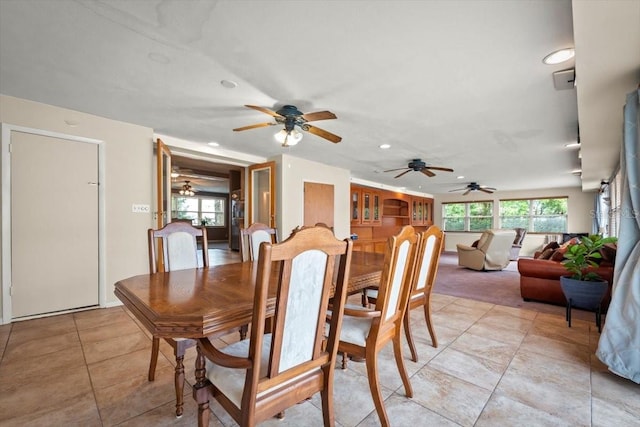 dining space featuring recessed lighting, a healthy amount of sunlight, and light tile patterned flooring