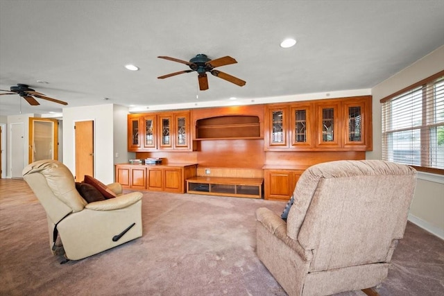 carpeted living room featuring a ceiling fan and recessed lighting