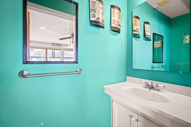 bathroom with ceiling fan and vanity