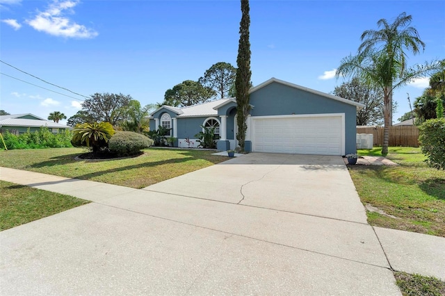 single story home featuring a garage and a front yard