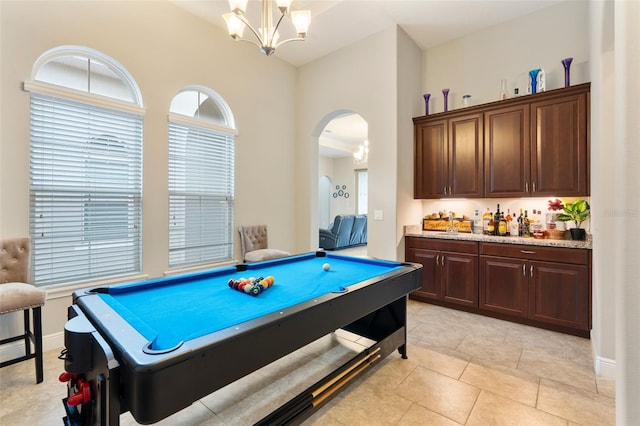 recreation room featuring an inviting chandelier, billiards, and light tile patterned floors