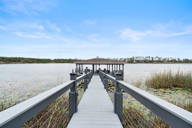 dock area with a gazebo and a water view