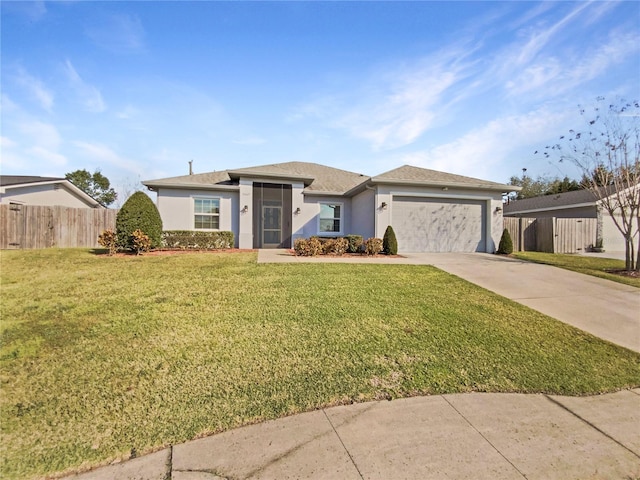 view of front of home with a garage and a front yard