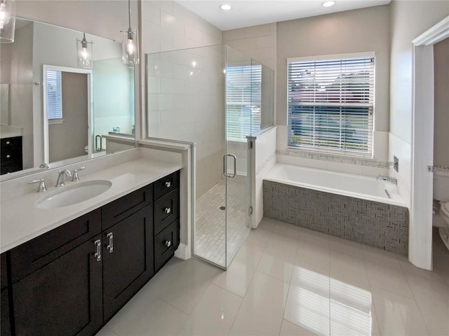 full bathroom with vanity, tile patterned floors, plus walk in shower, and toilet