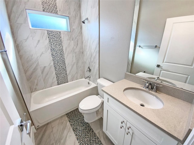 full bathroom with vanity, toilet, and tiled shower / bath combo