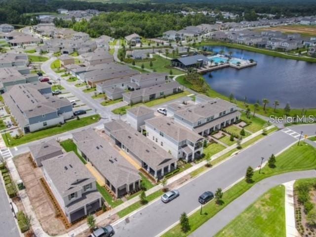 birds eye view of property with a water view