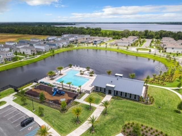 birds eye view of property featuring a water view