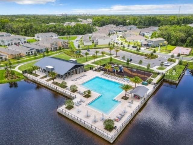 birds eye view of property with a water view