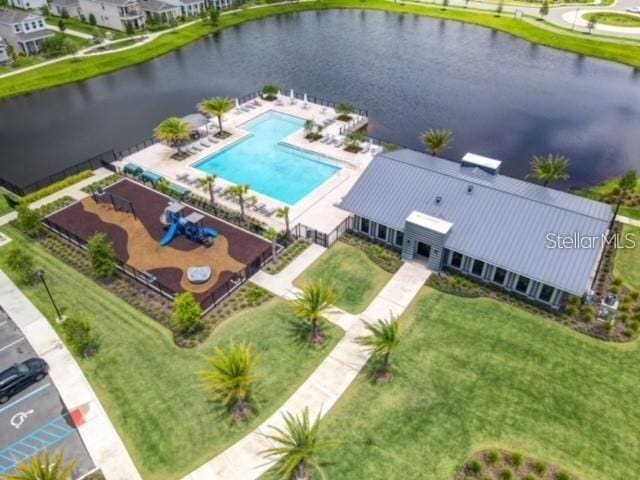 birds eye view of property with a water view