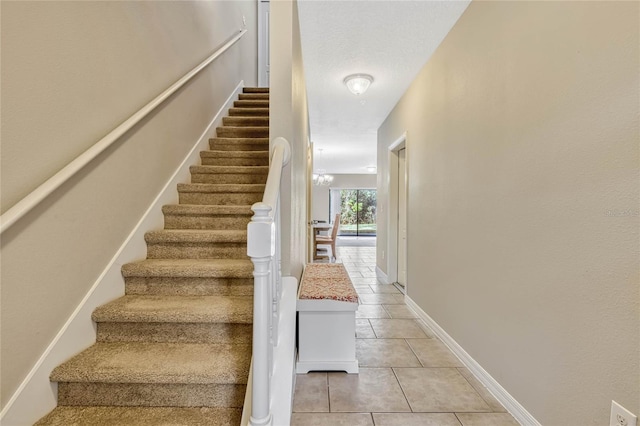 staircase with tile patterned floors