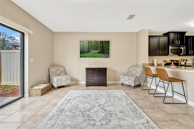 living area with light tile patterned floors