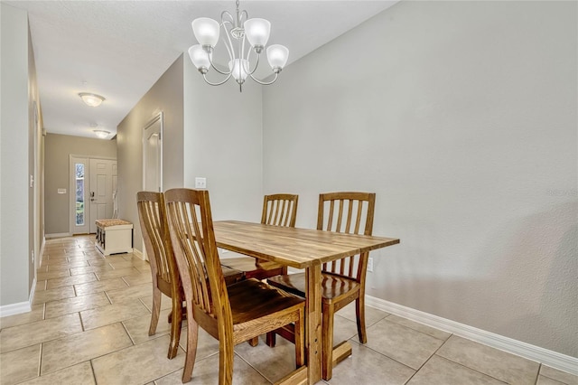 dining space with a notable chandelier