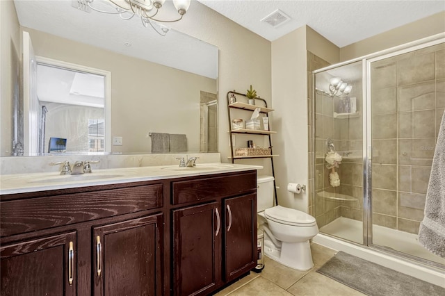 bathroom featuring walk in shower, tile patterned floors, toilet, vanity, and a notable chandelier
