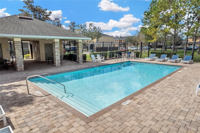 view of swimming pool with a patio