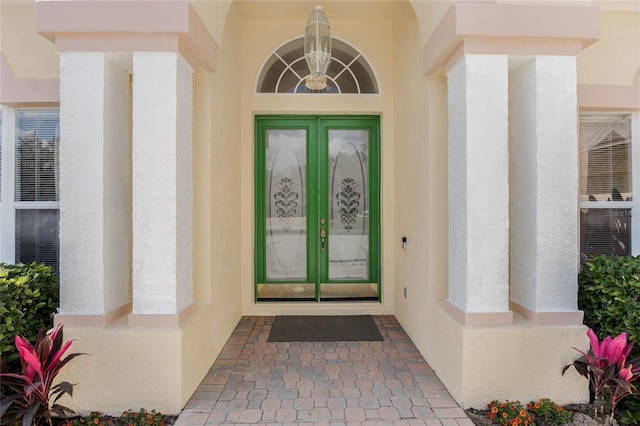 126 Seville Chase Dr, Winter Springs, FL 32708 - doorway to property with french doors and stucco siding