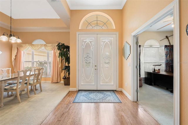 126 Seville Chase Dr, Winter Springs, FL 32708 - foyer entrance featuring a chandelier, hardwood / wood-style flooring, french doors, baseboards, and ornamental molding