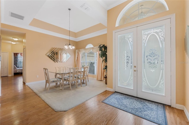 126 Seville Chase Dr, Winter Springs, FL 32708 - entryway featuring a chandelier, wood finished floors, french doors, and baseboards