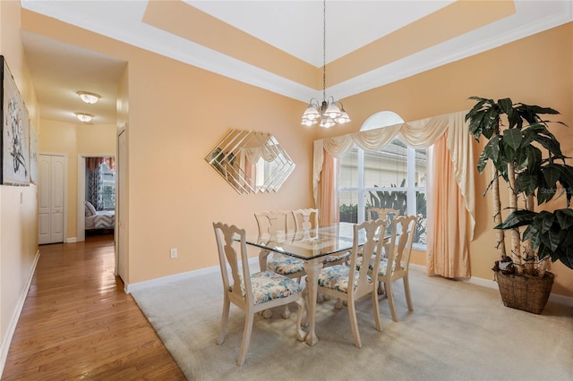126 Seville Chase Dr, Winter Springs, FL 32708 - dining area with a chandelier, healthy amount of natural light, baseboards, and light wood-type flooring