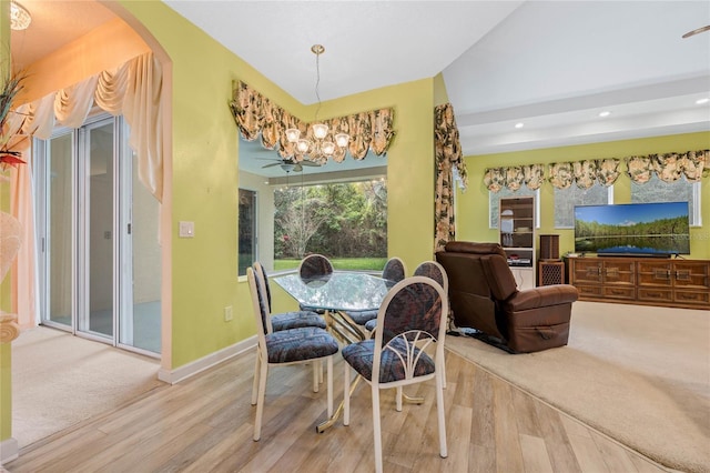 126 Seville Chase Dr, Winter Springs, FL 32708 - dining room with wood finished floors, a chandelier, arched walkways, recessed lighting, and baseboards