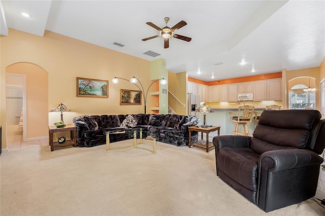 126 Seville Chase Dr, Winter Springs, FL 32708 - living room featuring a ceiling fan, arched walkways, and light colored carpet