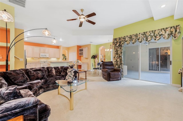 126 Seville Chase Dr, Winter Springs, FL 32708 - living room with ceiling fan, light carpet, a chandelier, arched walkways, and recessed lighting